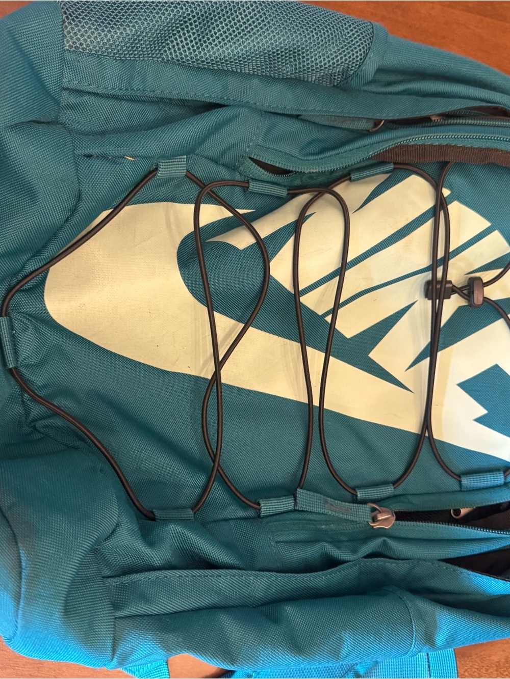 Nike Teal Backpack with White Swoosh and Bungee Cord